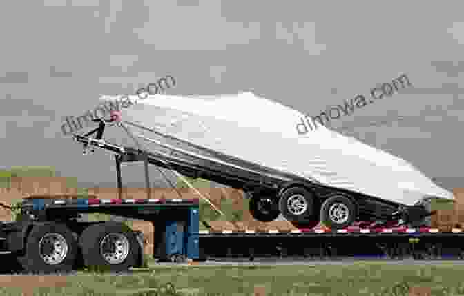 A Boat Being Secured Onto A Trailer For Transportation The Complete Guide To Trailering Your Boat: How To Select Use Maintain And Improve Boat Trailers