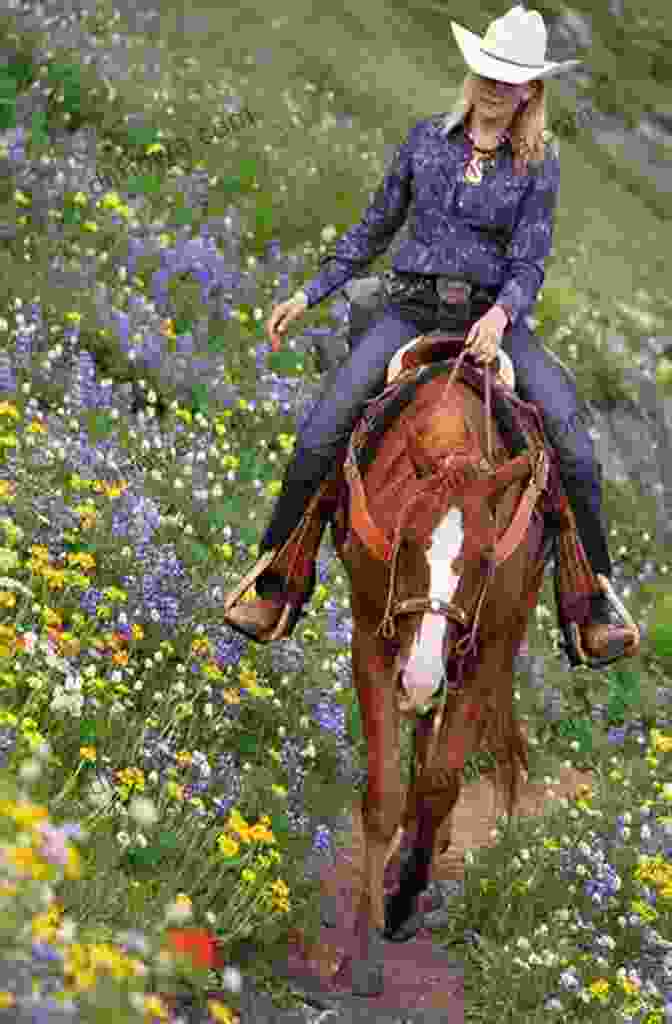 A Cowboy On Horseback Riding Through A Field Of Wildflowers Cowboy For Keeps (Mustang Valley 4)