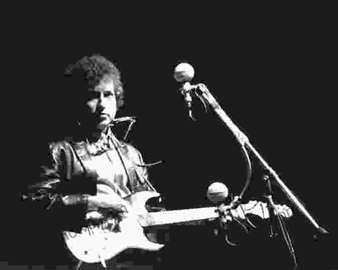 A Photograph Of Bob Dylan Performing At The Newport Folk Festival In 1965. American Pop: Hit Makers Superstars And Dance Revolutionaries (American Music Milestones)