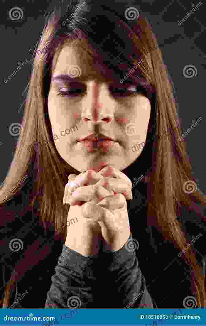 A Young Woman Praying With Her Hands Clasped Together And Her Eyes Closed. A Of Prayers For Young Women