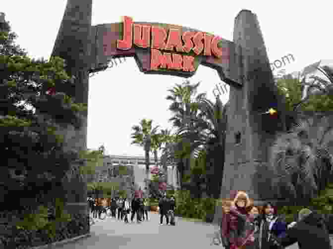 An Image Of The Jurassic Park Ride At Universal Studios Japan, With Visitors Riding Through A Lush Jungle Filled With Animatronic Dinosaurs. The Reasons Why Tokyo Disneyland Increases Its Admission Fee 4 Years In Row: Has Universal Studios Japan Already Surpassed Tokyo Disneyland?