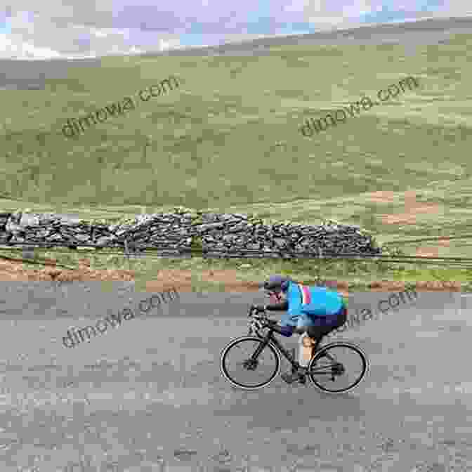 Cyclist Battling The Elements On The Exposed Moorland Of Fleet Moss. Cycling Climbs Of Yorkshire (Regional Cycling Climbs 2)
